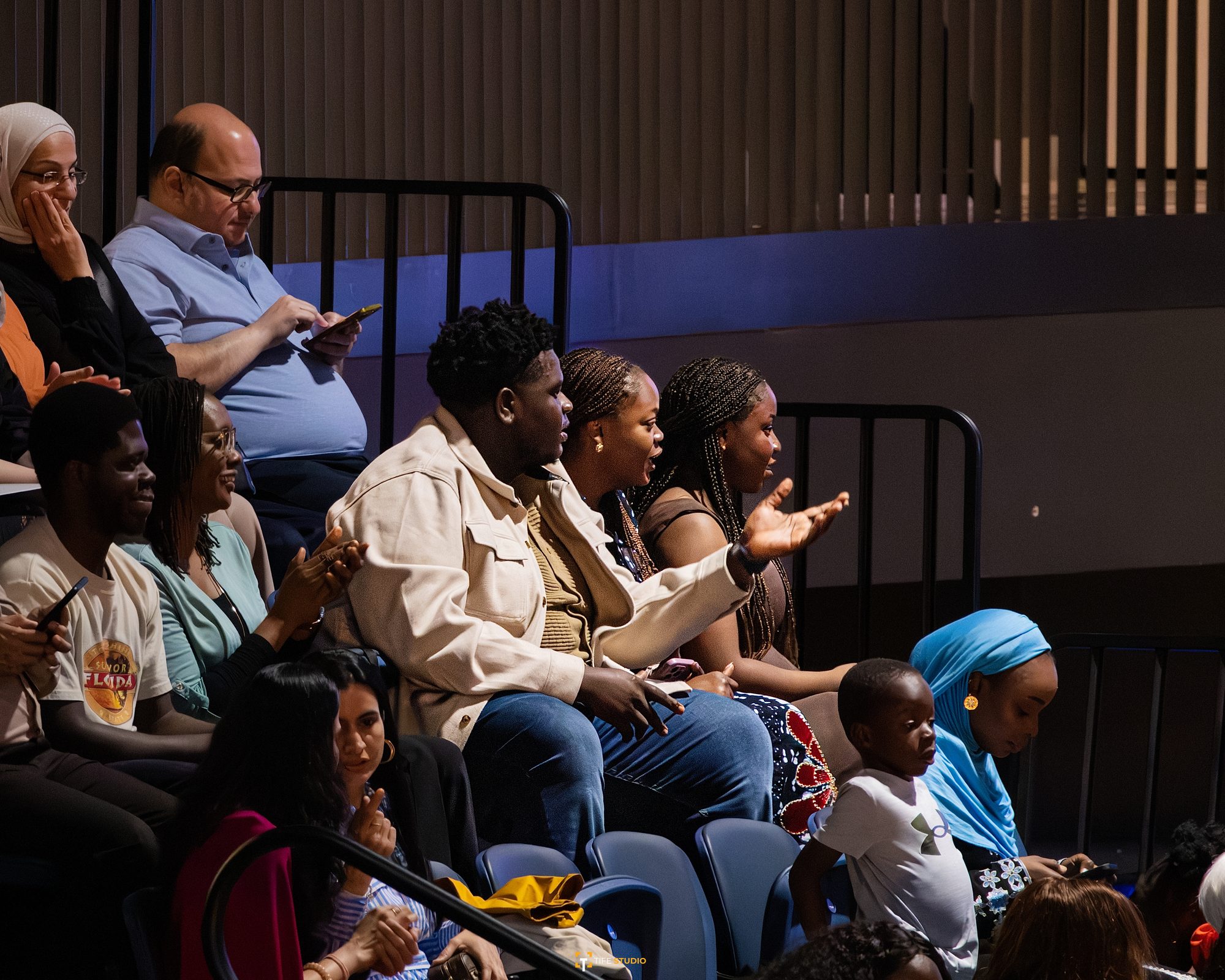 Family audience at graduation ceremony
